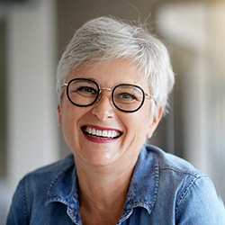 Mature woman with dental bridges in Sagamore Hills smiling