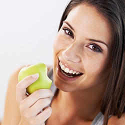 Woman eating an apple