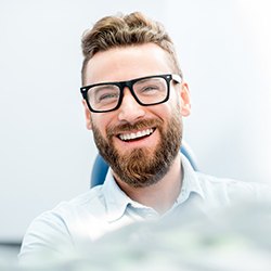 Closeup of man smiling in dentist's treatment chair