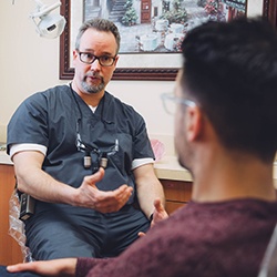 Dr. Greenwood talking to dental patient