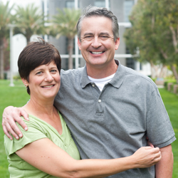 Older couple outside home