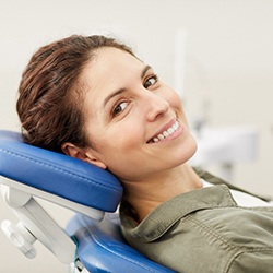 Woman with dental crown in Sagamore Hills smiling at dentist