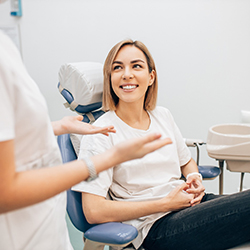 patient asking dentist in Greenwood questions about dental crowns