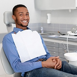 young man sitting in the dental chair 