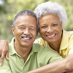 happy elderly couple in a park