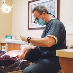 Dentist treating patient