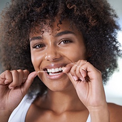 Woman flossing