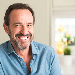 Smiling man wearing a blue shirt