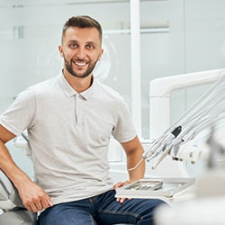 Man sitting in dental chair smiling
