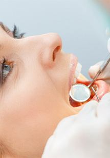 woman visiting dentist for checkup