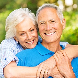 Senior couple smiling outdoors