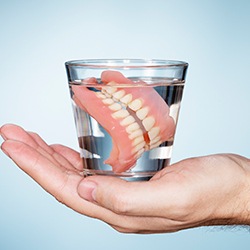 Full dentures in glass of water