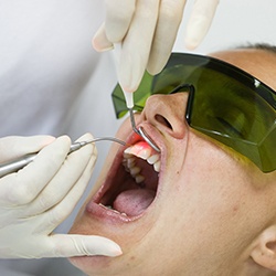 Patient receiving soft tissue laser therapy